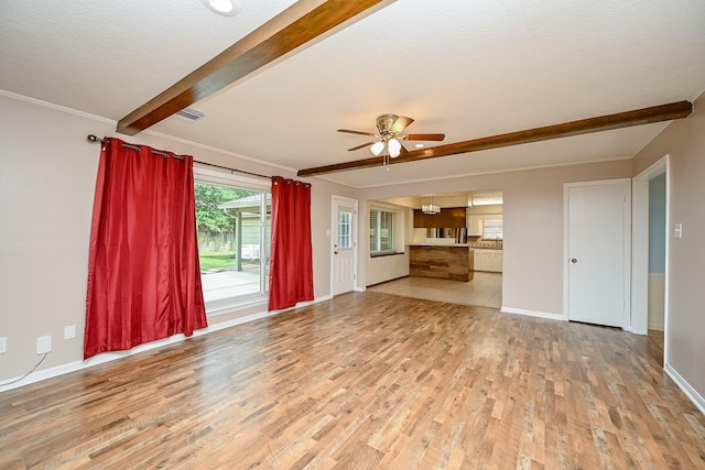 19515 Oak Timbers Dr, Humble, TX 77346 - unfurnished living room featuring light wood-style flooring, a ceiling fan, beamed ceiling, baseboards, and ornamental molding