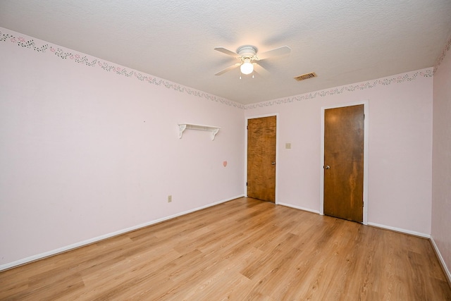 19515 Oak Timbers Dr, Humble, TX 77346 - unfurnished bedroom with light wood-style floors, baseboards, and ceiling fan