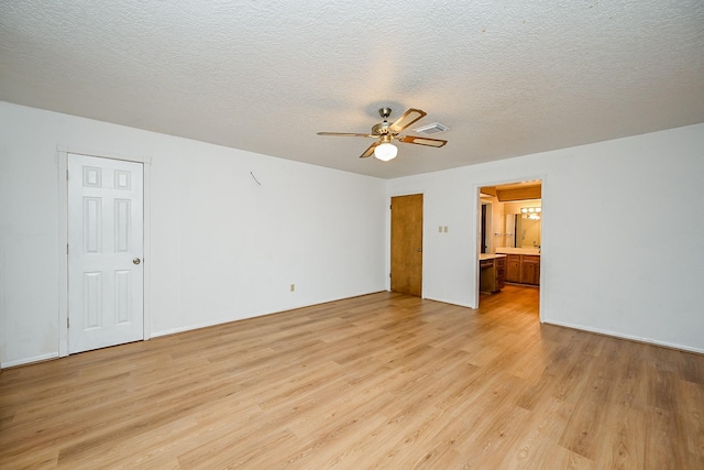 19515 Oak Timbers Dr, Humble, TX 77346 - unfurnished room with light wood-type flooring, ceiling fan, and a textured ceiling