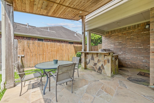 219 Rolling Springs Ln, Dickinson, TX 77539 - view of patio featuring area for grilling and outdoor dining space