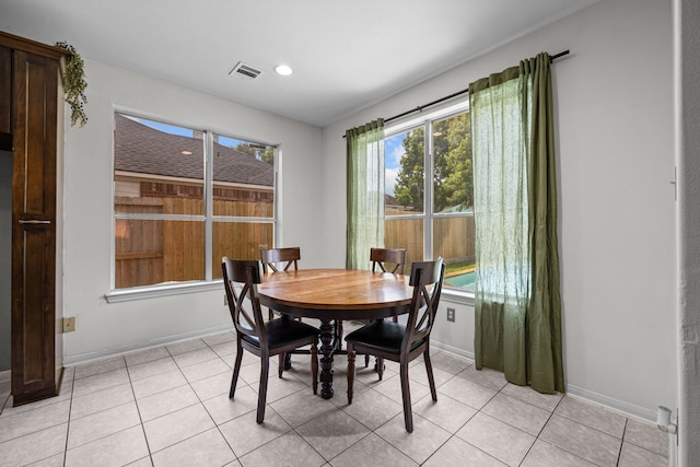 219 Rolling Springs Ln, Dickinson, TX 77539 - dining space featuring plenty of natural light, baseboards, light tile patterned floors, and recessed lighting