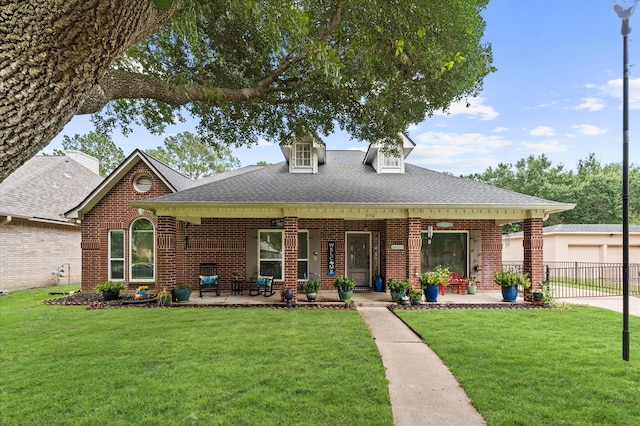 3102 E Elm Cir, Katy, TX 77493 - view of front facade with brick siding, a front yard, and a shingled roof