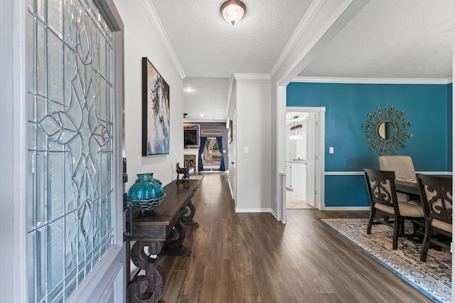 3102 E Elm Cir, Katy, TX 77493 - foyer entrance featuring wood finished floors, baseboards, ornamental molding, and a textured ceiling
