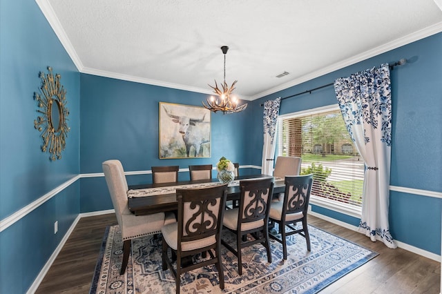3102 E Elm Cir, Katy, TX 77493 - dining room with a chandelier, wood finished floors, baseboards, crown molding, and a textured ceiling