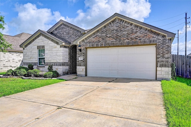 31702 Casa Linda Dr, Hockley, TX 77447 - french provincial home with brick siding, concrete driveway, stone siding, and an attached garage