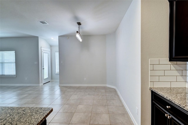 31702 Casa Linda Dr, Hockley, TX 77447 - unfurnished dining area with light tile patterned flooring and baseboards