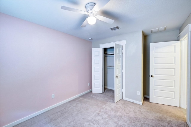 31702 Casa Linda Dr, Hockley, TX 77447 - unfurnished bedroom with light carpet, a closet, and a ceiling fan