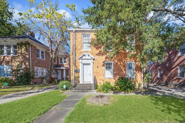 1842 W Alabama St, Houston, TX 77098 - view of front of property featuring a front lawn and brick siding