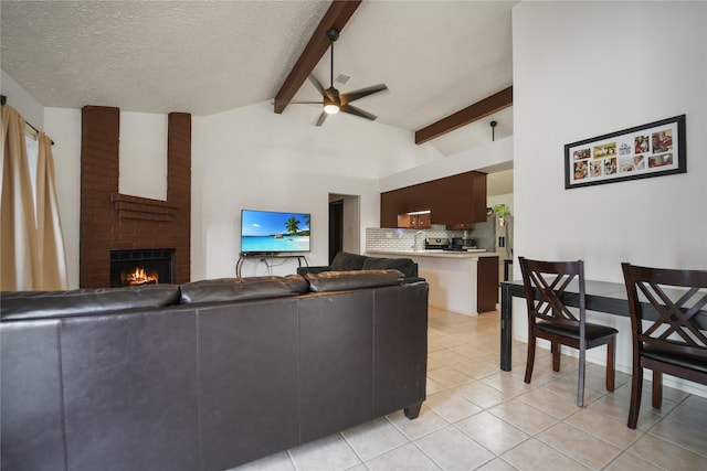 9228 Waving Fields Dr, Houston, TX 77064 - living room featuring a brick fireplace, ceiling fan, light tile patterned floors, and a textured ceiling
