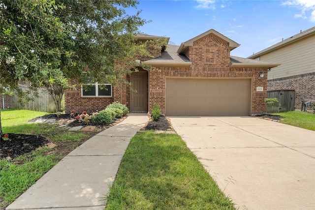 2206 Hidden Meadow Ln, Pearland, TX 77089 - view of front of home featuring brick siding, an attached garage, concrete driveway, and a shingled roof