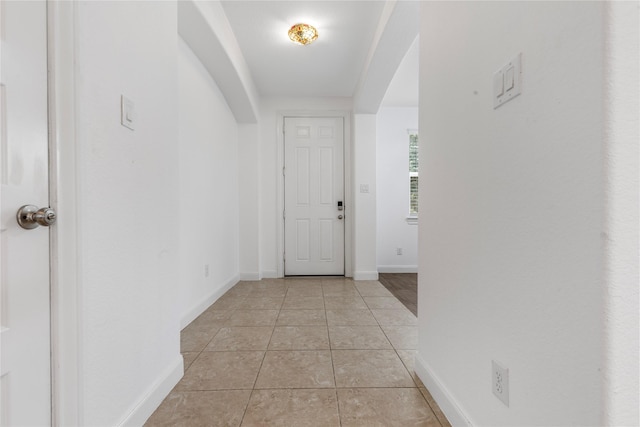 2206 Hidden Meadow Ln, Pearland, TX 77089 - corridor with light tile patterned floors and baseboards