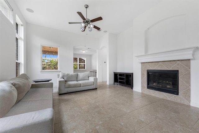 2206 Hidden Meadow Ln, Pearland, TX 77089 - tiled living area featuring ceiling fan and a tile fireplace