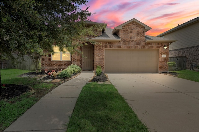 2206 Hidden Meadow Ln, Pearland, TX 77089 - view of front of house with brick siding, a garage, and concrete driveway