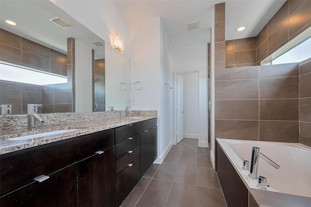 5012 Cornish St, Houston, TX 77007 - full bathroom featuring double vanity, a bath, tile patterned floors, baseboards, and recessed lighting