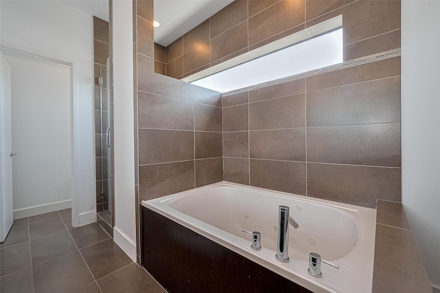 5012 Cornish St, Houston, TX 77007 - full bath with a whirlpool tub, tile patterned floors, and a shower stall