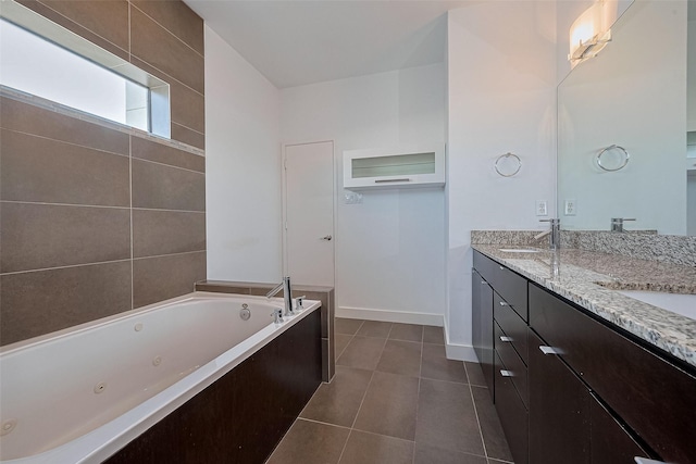 5012 Cornish St, Houston, TX 77007 - bathroom featuring double vanity, a jetted tub, tile patterned floors, and baseboards