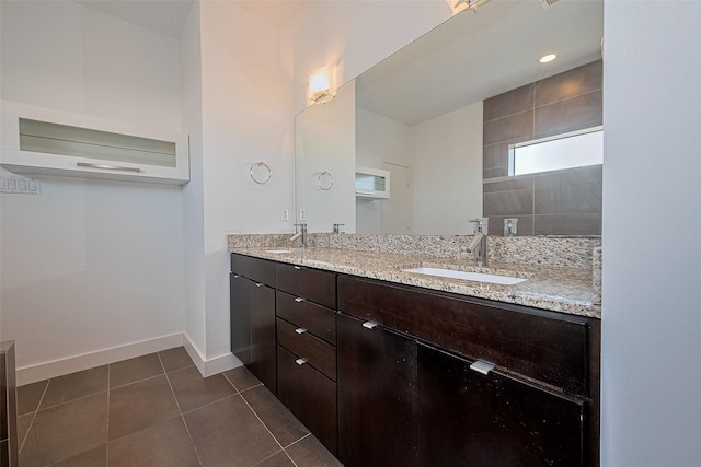 5012 Cornish St, Houston, TX 77007 - bathroom featuring double vanity, tile patterned floors, and baseboards
