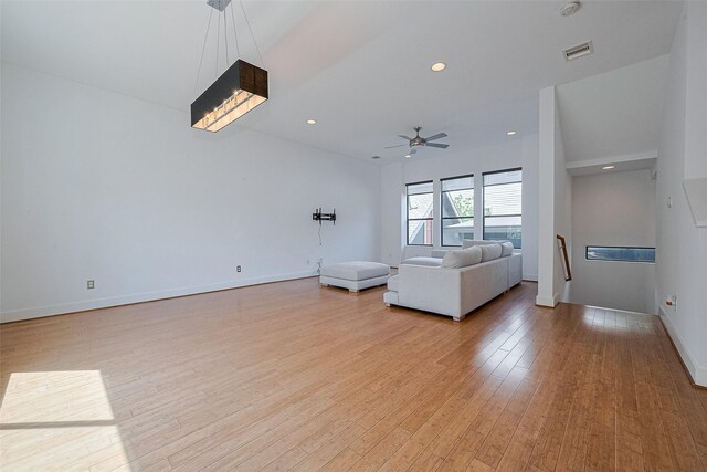 5012 Cornish St, Houston, TX 77007 - living room featuring light wood-type flooring, a ceiling fan, baseboards, and recessed lighting