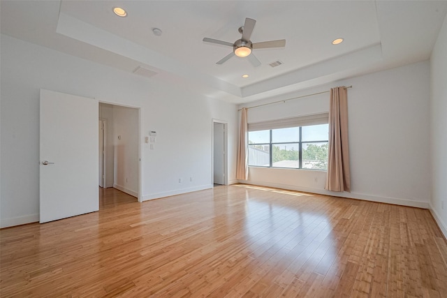 5012 Cornish St, Houston, TX 77007 - unfurnished room featuring a raised ceiling, light wood-style floors, baseboards, ceiling fan, and recessed lighting