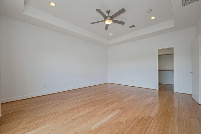 5012 Cornish St, Houston, TX 77007 - empty room featuring a raised ceiling, light wood-style floors, ceiling fan, baseboards, and recessed lighting
