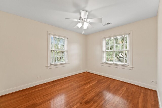2044 Branard St, Houston, TX 77098 - unfurnished room with plenty of natural light, hardwood / wood-style flooring, baseboards, and a ceiling fan