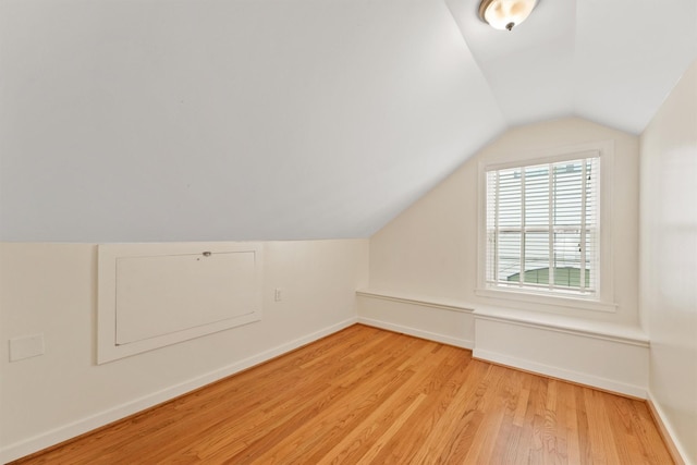 2044 Branard St, Houston, TX 77098 - bonus room with light wood-style flooring, vaulted ceiling, and baseboards