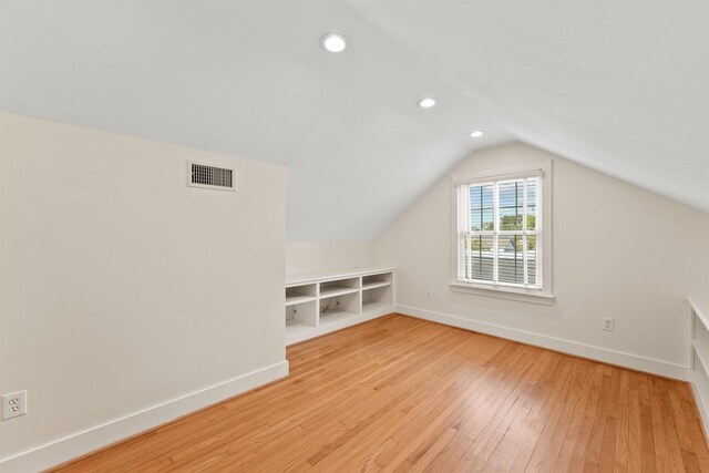 2044 Branard St, Houston, TX 77098 - bonus room with baseboards, lofted ceiling, light wood-type flooring, and recessed lighting