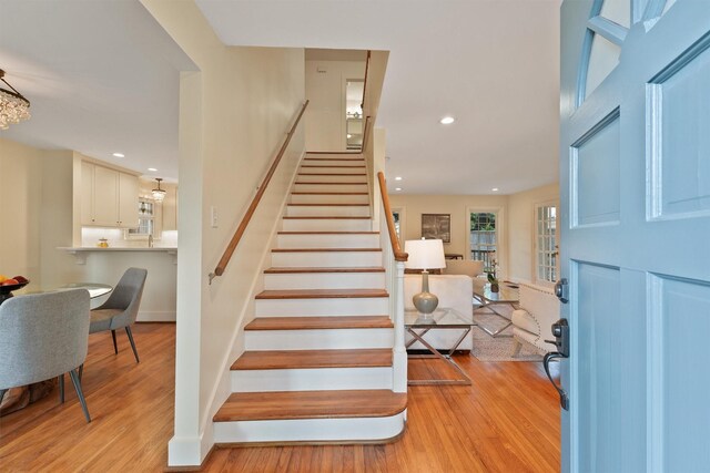 2044 Branard St, Houston, TX 77098 - staircase with wood finished floors and recessed lighting