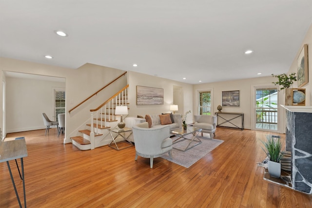 2044 Branard St, Houston, TX 77098 - living area with stairway, light wood-type flooring, recessed lighting, and a fireplace