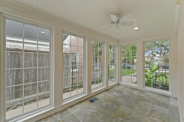 2044 Branard St, Houston, TX 77098 - unfurnished sunroom with stone tile floors, healthy amount of natural light, and recessed lighting