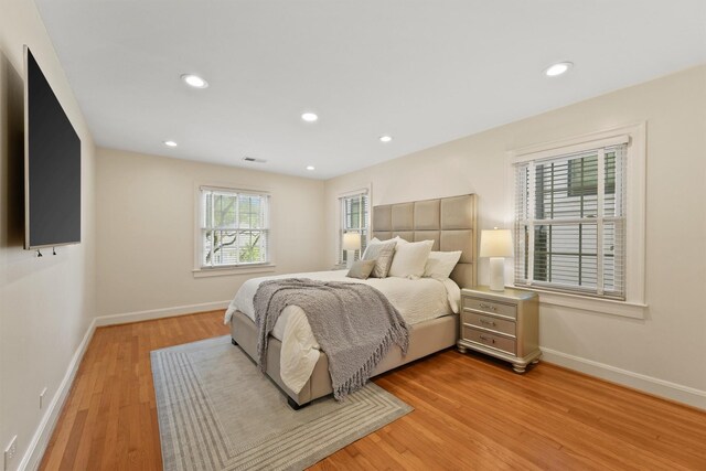2044 Branard St, Houston, TX 77098 - bedroom featuring light wood finished floors, baseboards, and recessed lighting