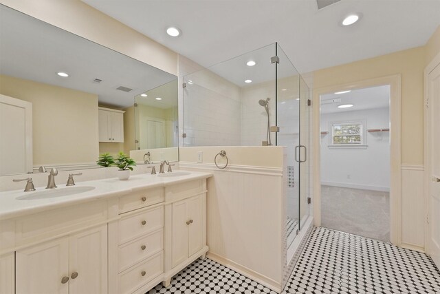 2044 Branard St, Houston, TX 77098 - bathroom with a stall shower, double vanity, and recessed lighting