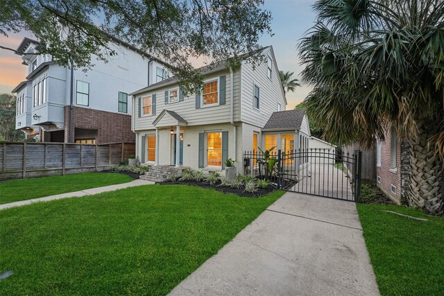 2044 Branard St, Houston, TX 77098 - view of front of home featuring a gate, brick siding, and concrete driveway