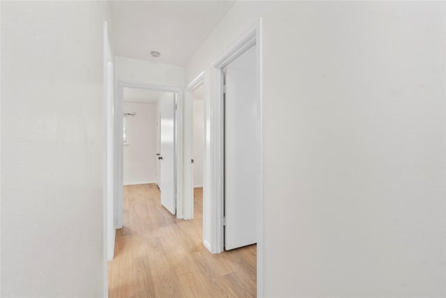 8903 Roos Rd, Houston, TX 77036 - hall with light wood-style flooring and baseboards
