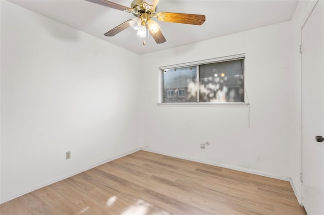 8903 Roos Rd, Houston, TX 77036 - spare room with light wood-style floors, ceiling fan, and baseboards