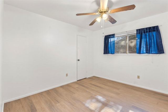 8903 Roos Rd, Houston, TX 77036 - spare room with light wood-type flooring, baseboards, and ceiling fan