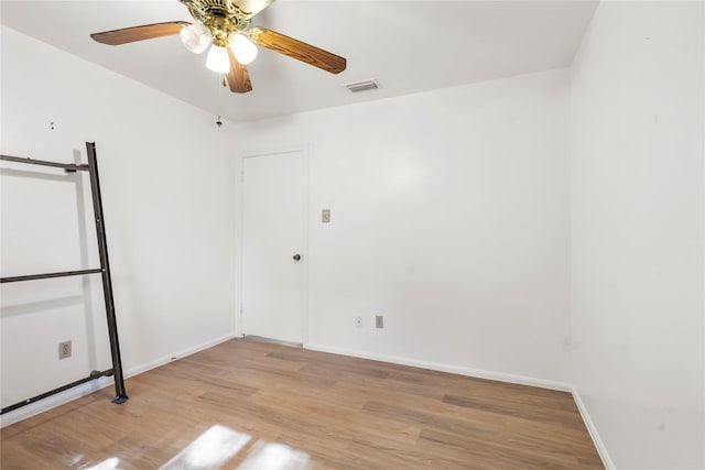 8903 Roos Rd, Houston, TX 77036 - empty room featuring wood finished floors, baseboards, and ceiling fan