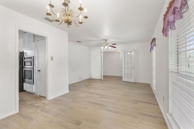 8903 Roos Rd, Houston, TX 77036 - unfurnished room featuring a chandelier, light wood-type flooring, ceiling fan, and baseboards