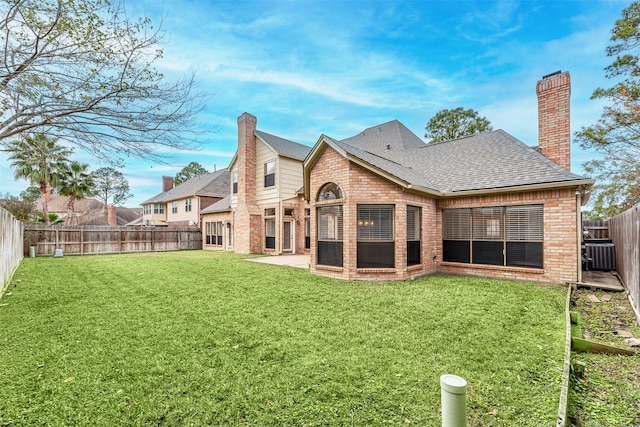 13223 Oregold Dr, Houston, TX 77041 - rear view of house featuring brick siding, a chimney, cooling unit, roof with shingles, and a patio