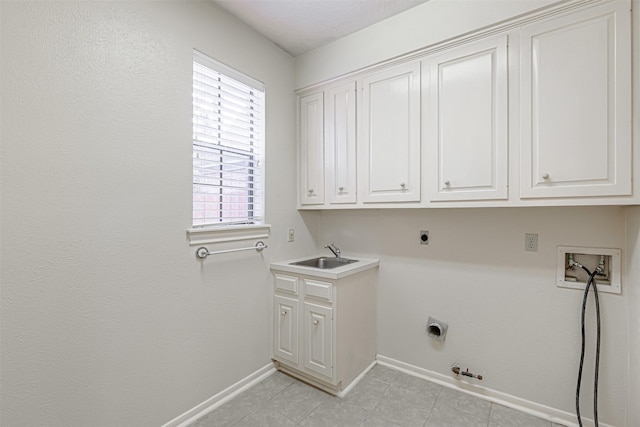 13223 Oregold Dr, Houston, TX 77041 - laundry room with gas dryer hookup, electric dryer hookup, baseboards, and cabinet space