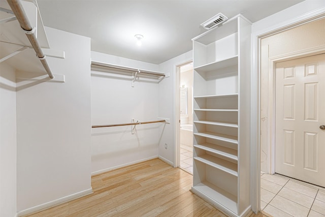 13223 Oregold Dr, Houston, TX 77041 - walk in closet with wood finished floors