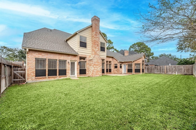 13223 Oregold Dr, Houston, TX 77041 - back of house with brick siding, a chimney, a patio, and roof with shingles