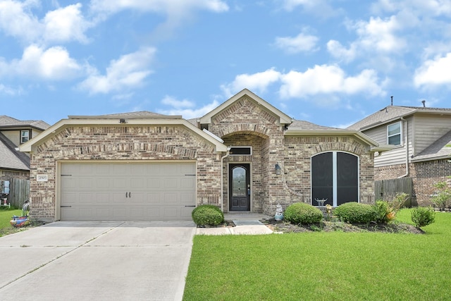 2507 Ocean Pass Ln, Richmond, TX 77469 - french provincial home with brick siding, driveway, and an attached garage