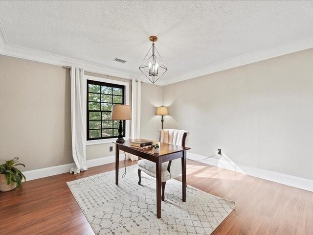 9622 Hanging Moss Trl, Houston, TX 77064 - office featuring ornamental molding, a chandelier, wood finished floors, baseboards, and a textured ceiling