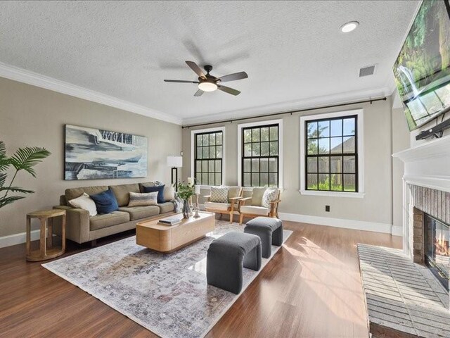 9622 Hanging Moss Trl, Houston, TX 77064 - living area featuring ceiling fan, wood finished floors, baseboards, crown molding, and a textured ceiling