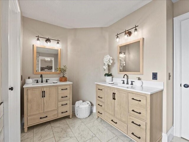 9622 Hanging Moss Trl, Houston, TX 77064 - bathroom with two vanities and marble look tiles