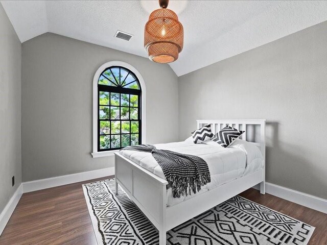 9622 Hanging Moss Trl, Houston, TX 77064 - bedroom with vaulted ceiling, wood finished floors, and baseboards
