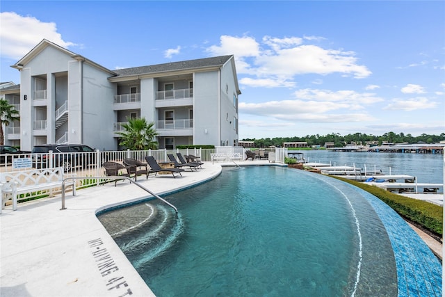 168 Lake Point Blvd Unit A204, Conroe, TX 77356 - community pool with a patio and a water view