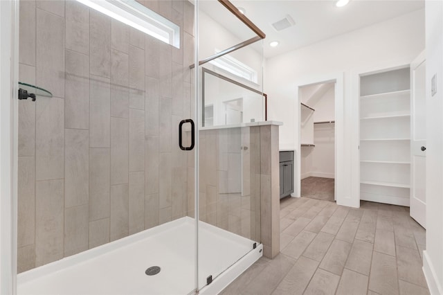 15147 Colorado Bend Park Dr, Cypress, TX 77433 - full bath with a shower stall, a spacious closet, wood finished floors, and recessed lighting