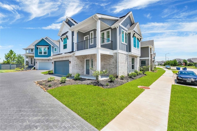 15147 Colorado Bend Park Dr, Cypress, TX 77433 - view of property with a balcony, an attached garage, driveway, and board and batten siding